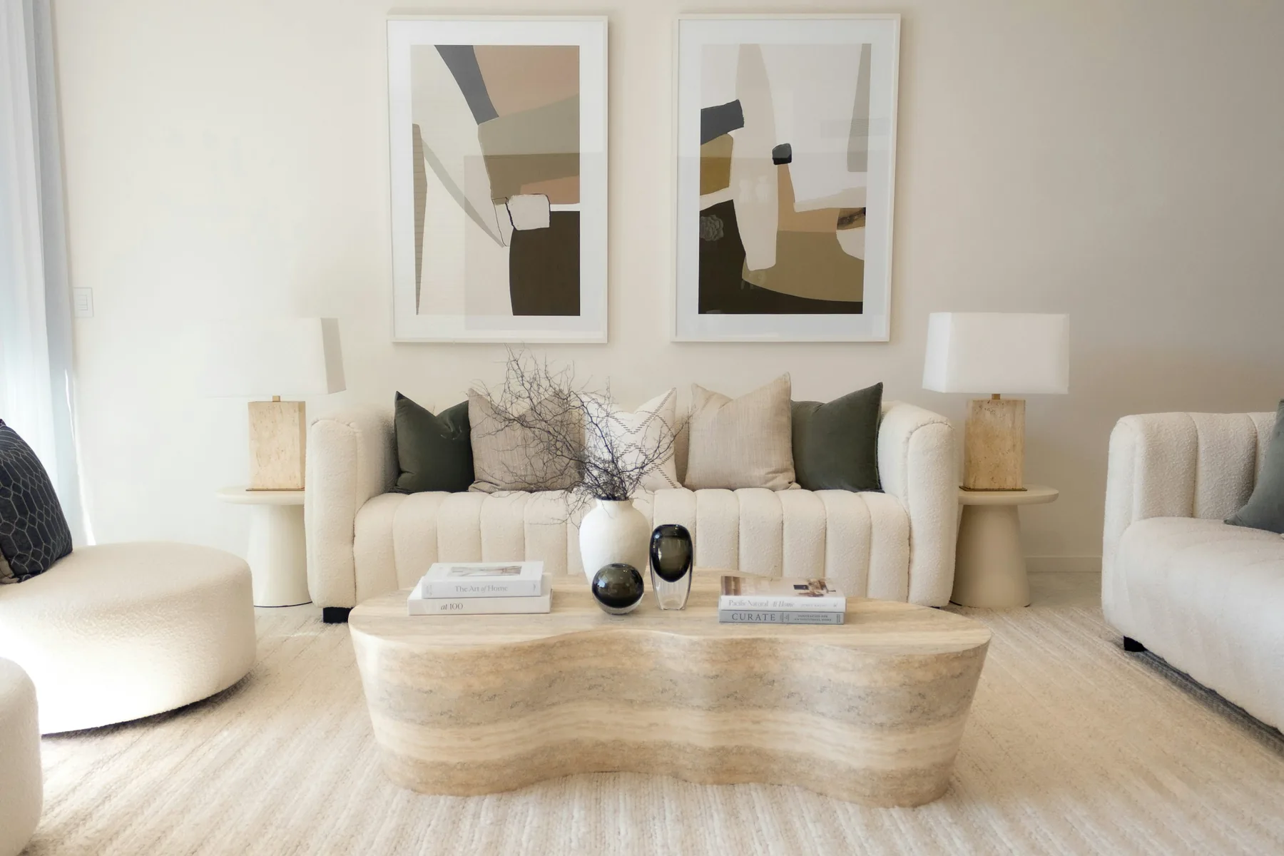 Premium neutral living room showing the calm outcome of a carefully maintained home